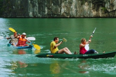 Cruising Lan Ha Bay and Ha Long Bay before returning to Hanoi (B, Br)